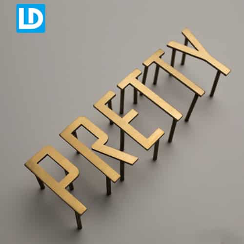 Flat Cut Metal Letter Sign | Non-Illuminated Wall Off Gold Logo