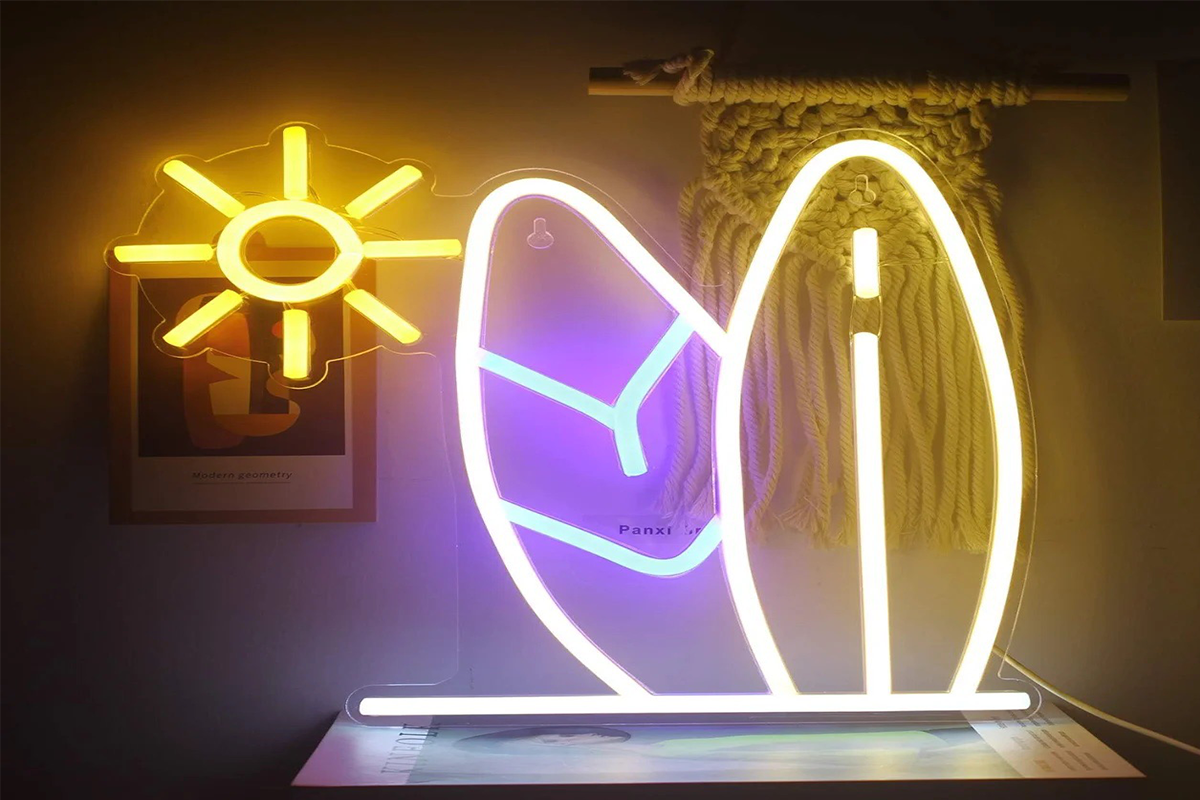 A neon light design with a sun and two leaves, glowing in yellow and blue